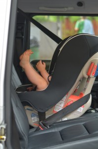 Toddler rear-facing in Combi Coccoro in taxi