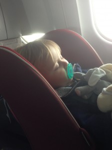 Eliza Stein son sleeping in Coccoro on plane