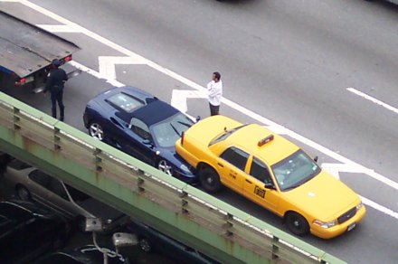 nyc taxi crash with convertible under a taxi as seen from my rubin dorm room