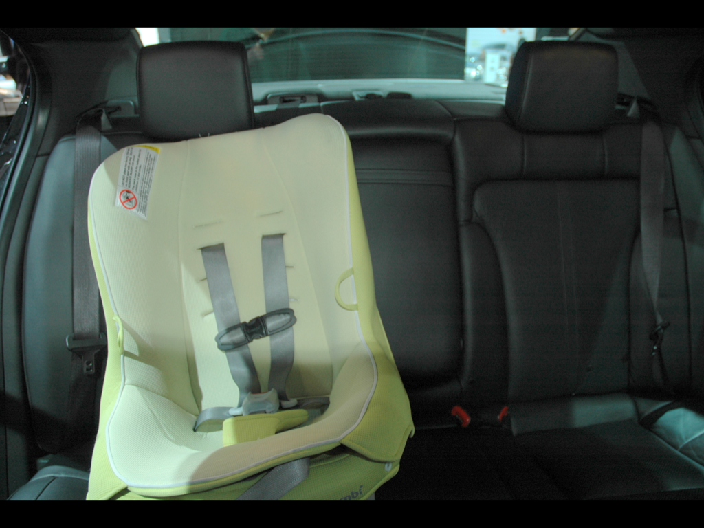 When there is a hump in the center, it doesn't work installing a car seat on the side with LATCH as the car seat straddles the hump. Vehicle shown: Lincoln MKS. Car seat: Combi Coccoro