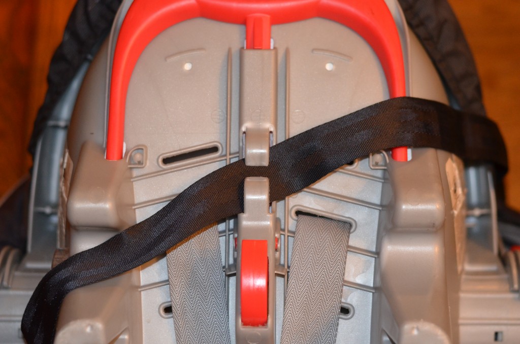 Close-up of shoulder belt routed through carrier when used withOUT the base